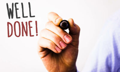 Conceptual hand writing showing Well Done Motivational Call. Business photos text Good Job Great Results Positive EvaluationMan holding pen pointing idea message black red letters white background.