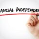 Hand writing Financial independence with marker, concept background