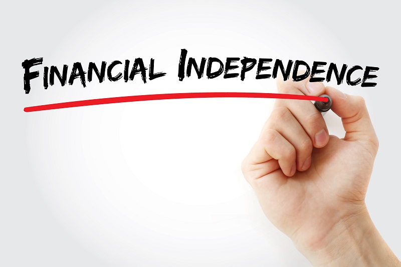 Hand writing Financial independence with marker, concept background